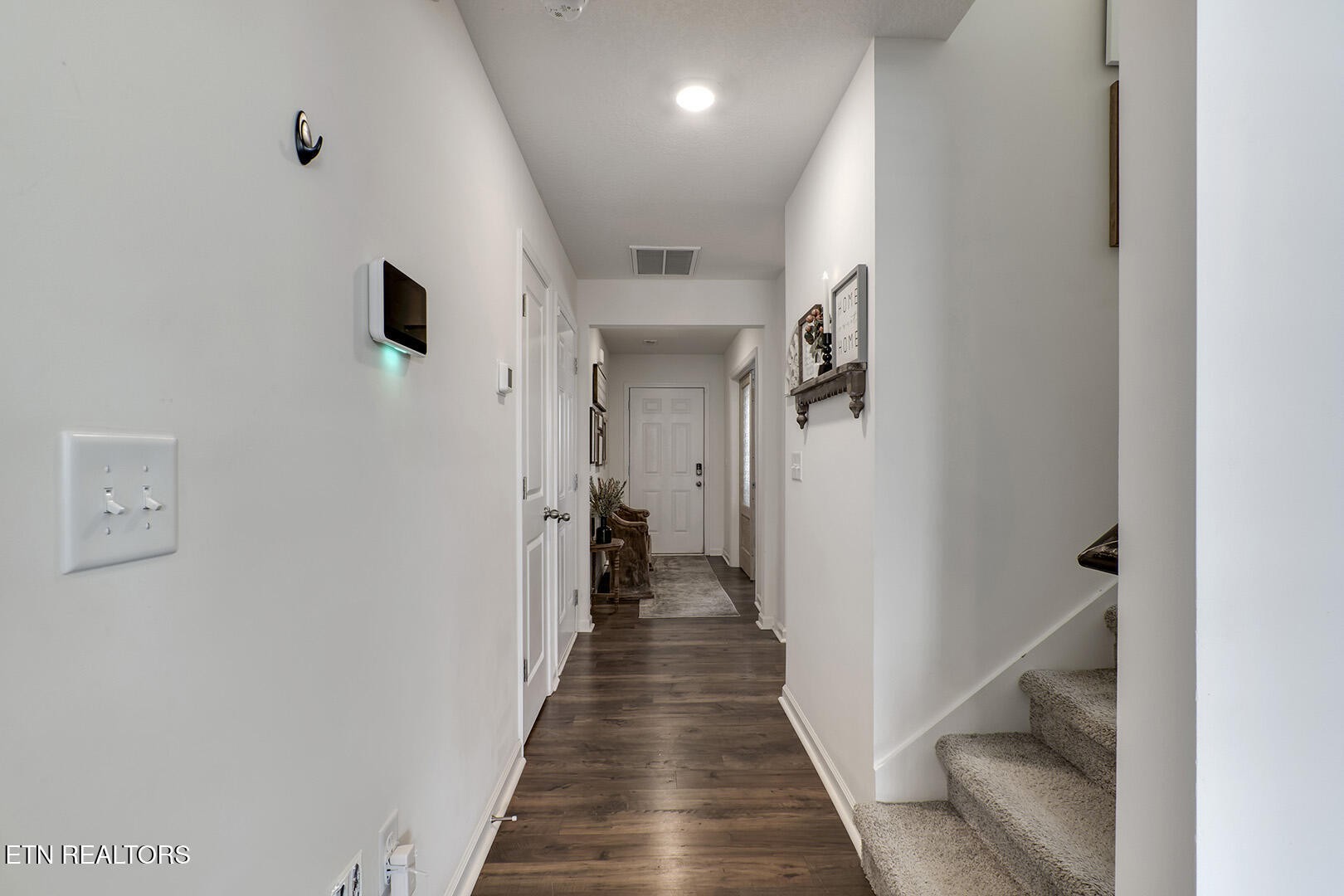 7519 Game Bird Street Corryton, TN 37721 - Photo 23 of 50 a view of a hallway with wooden floor and staircase