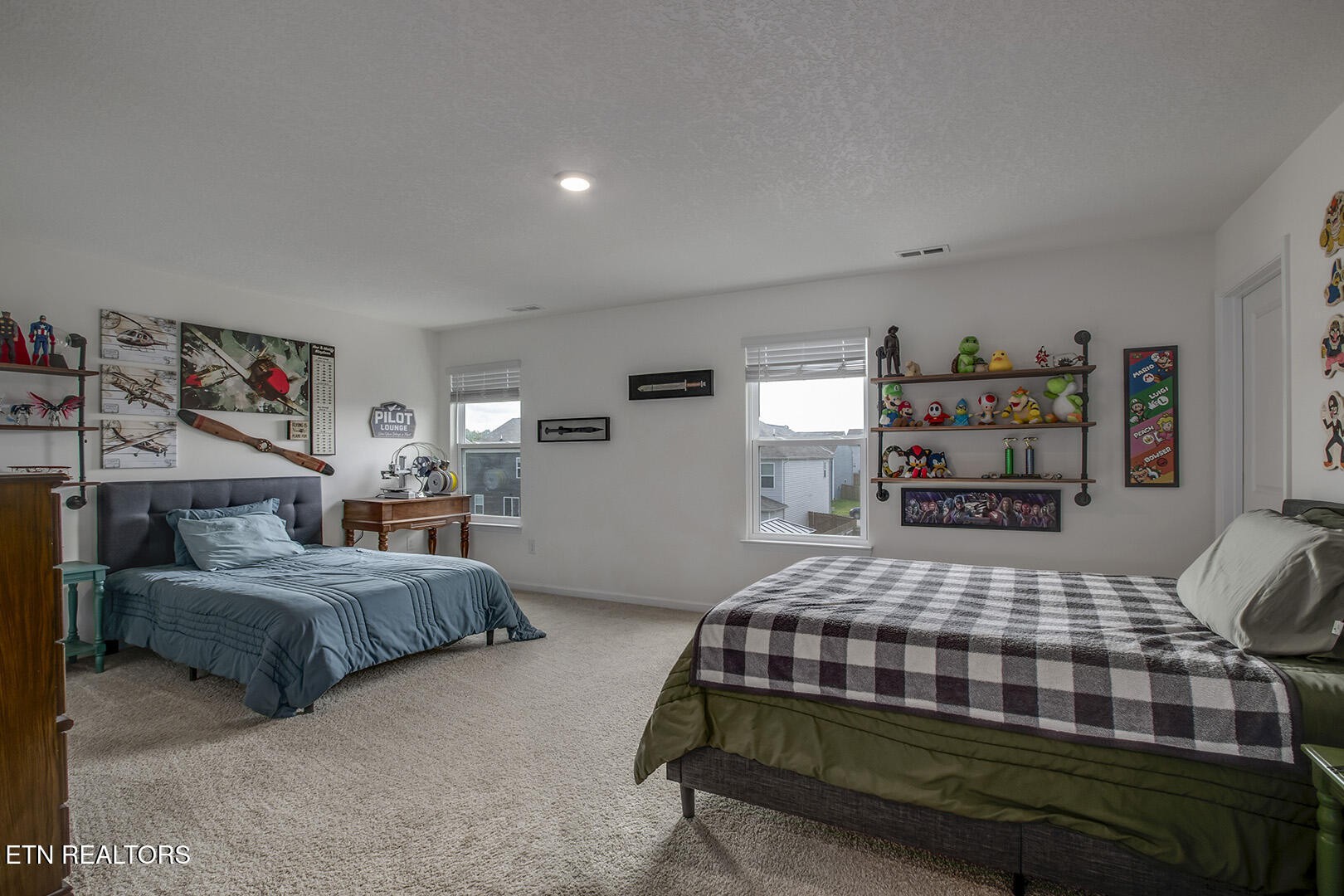 7519 Game Bird Street Corryton, TN 37721 - Photo 34 of 50 a bedroom with a bed and a bookshelf