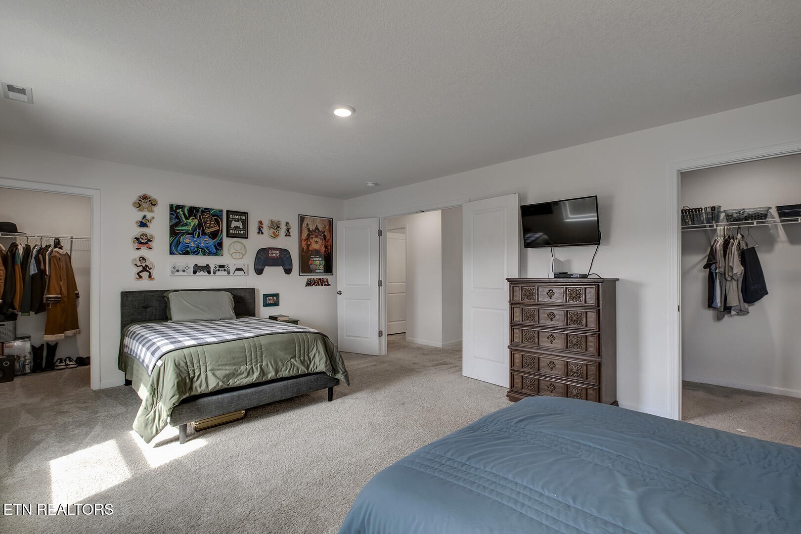 7519 Game Bird Street Corryton, TN 37721 - Photo 35 of 50 a spacious bedroom with a bed and a television