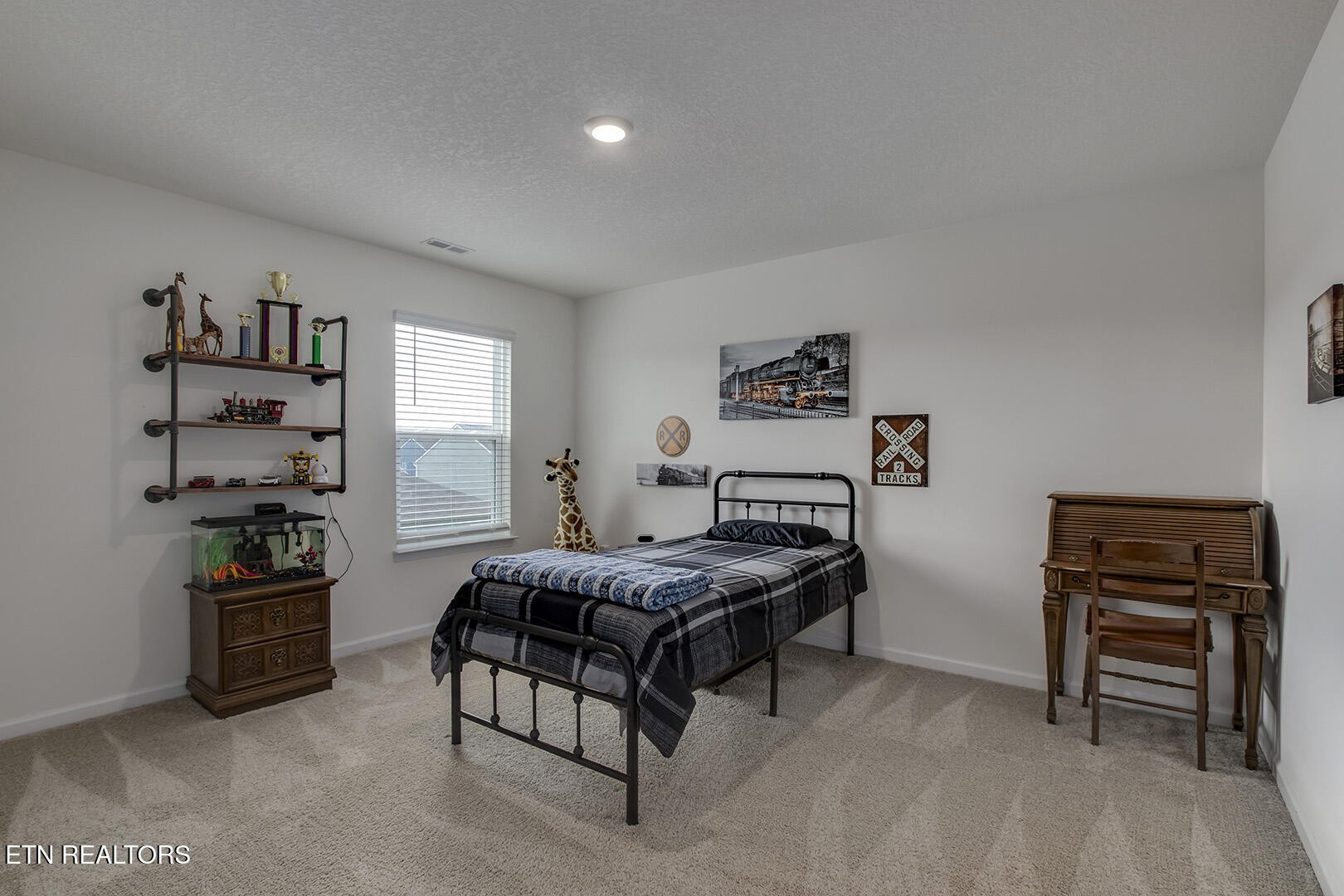 7519 Game Bird Street Corryton, TN 37721 - Photo 39 of 50 a bedroom with a bed and a bookshelf