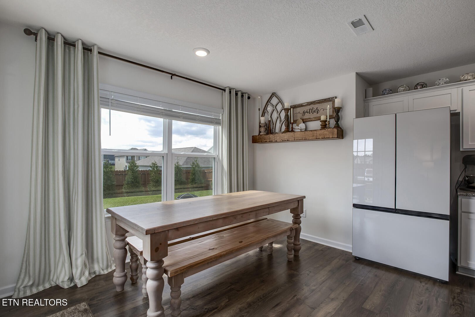 7519 Game Bird Street Corryton, TN 37721 - Photo 10 of 50 a kitchen with kitchen island a counter top space and a refrigerator