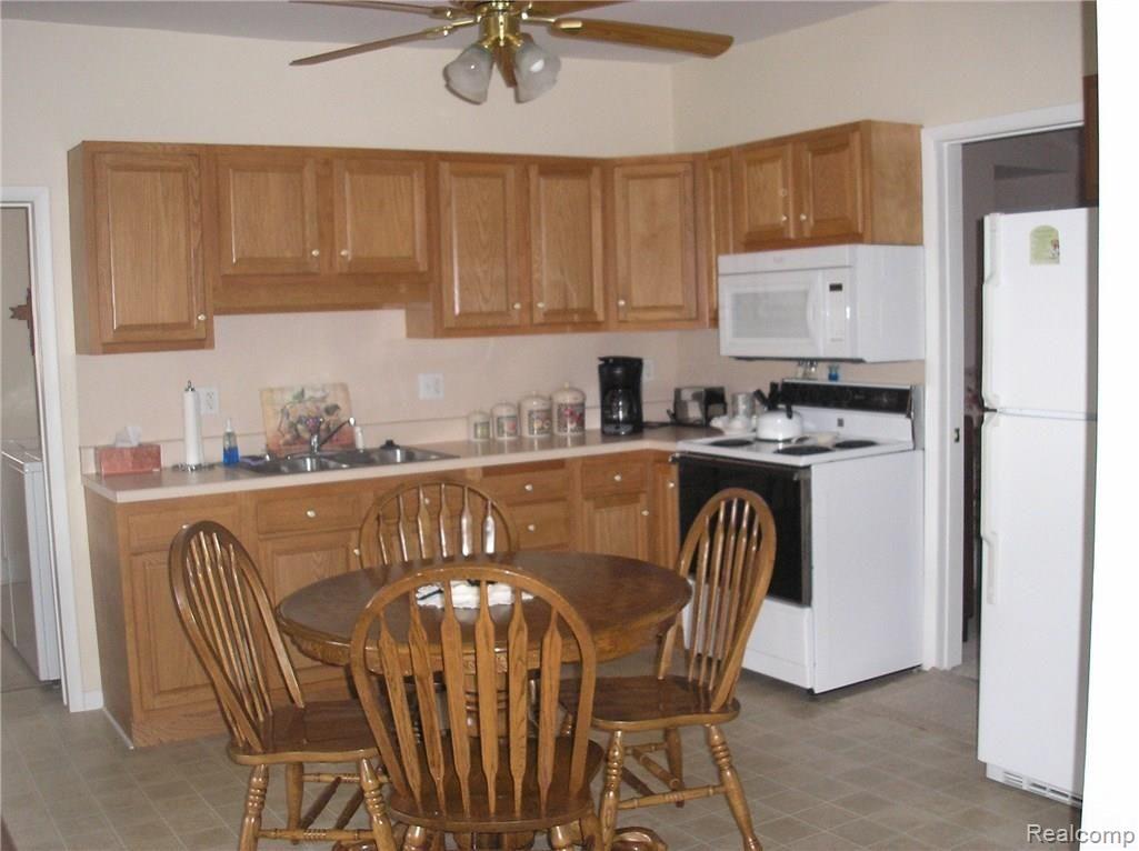 Large eat-in kitchen with  beautiful oak cabinets and appliances included.