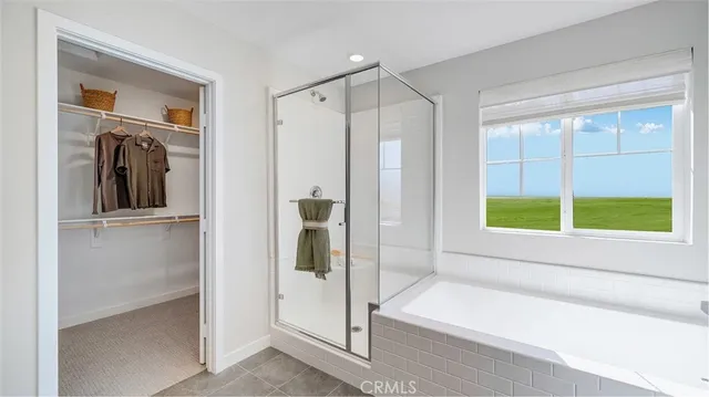 a bathroom with a tub and a shower