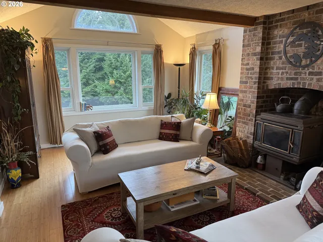 a living room with furniture fireplace and a flat screen tv