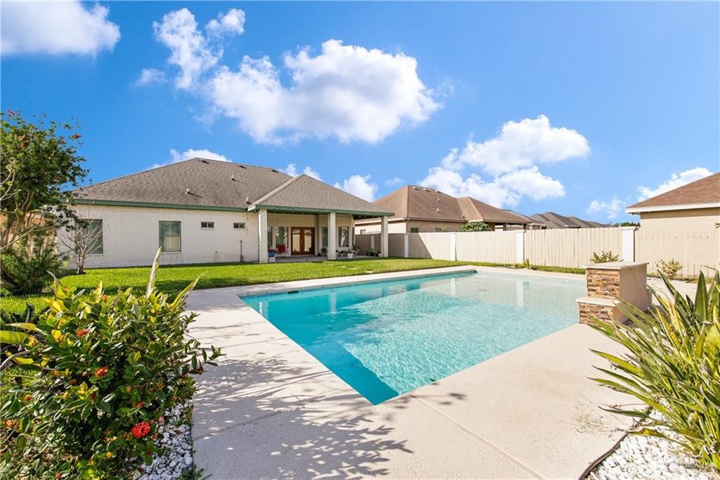 305 North 15th Street Hidalgo, TX 78557 - Photo 2 of 28 a view of a house with swimming pool and porch with furniture