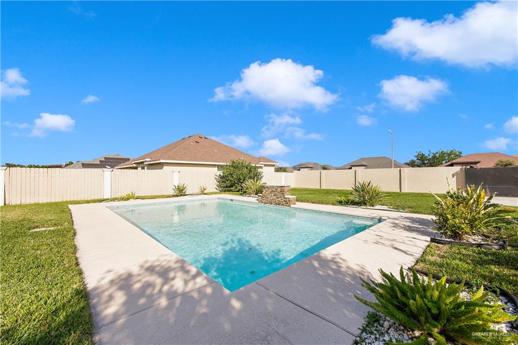 305 North 15th Street Hidalgo, TX 78557 - Photo 23 of 28 a view of a swimming pool with a yard
