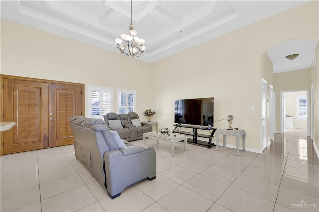 305 North 15th Street Hidalgo, TX 78557 - Photo 6 of 28 a living room with furniture and a flat screen tv