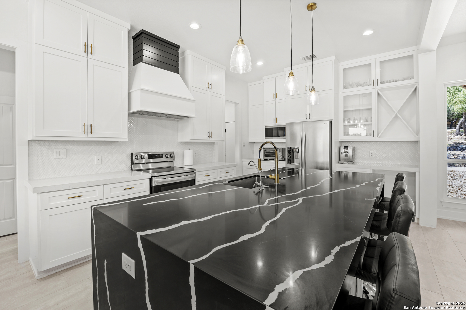 1101 Persimmon Pass Fischer, TX 78623 - Photo 12 of 43 a kitchen with stainless steel appliances granite countertop a sink a stove and a refrigerator