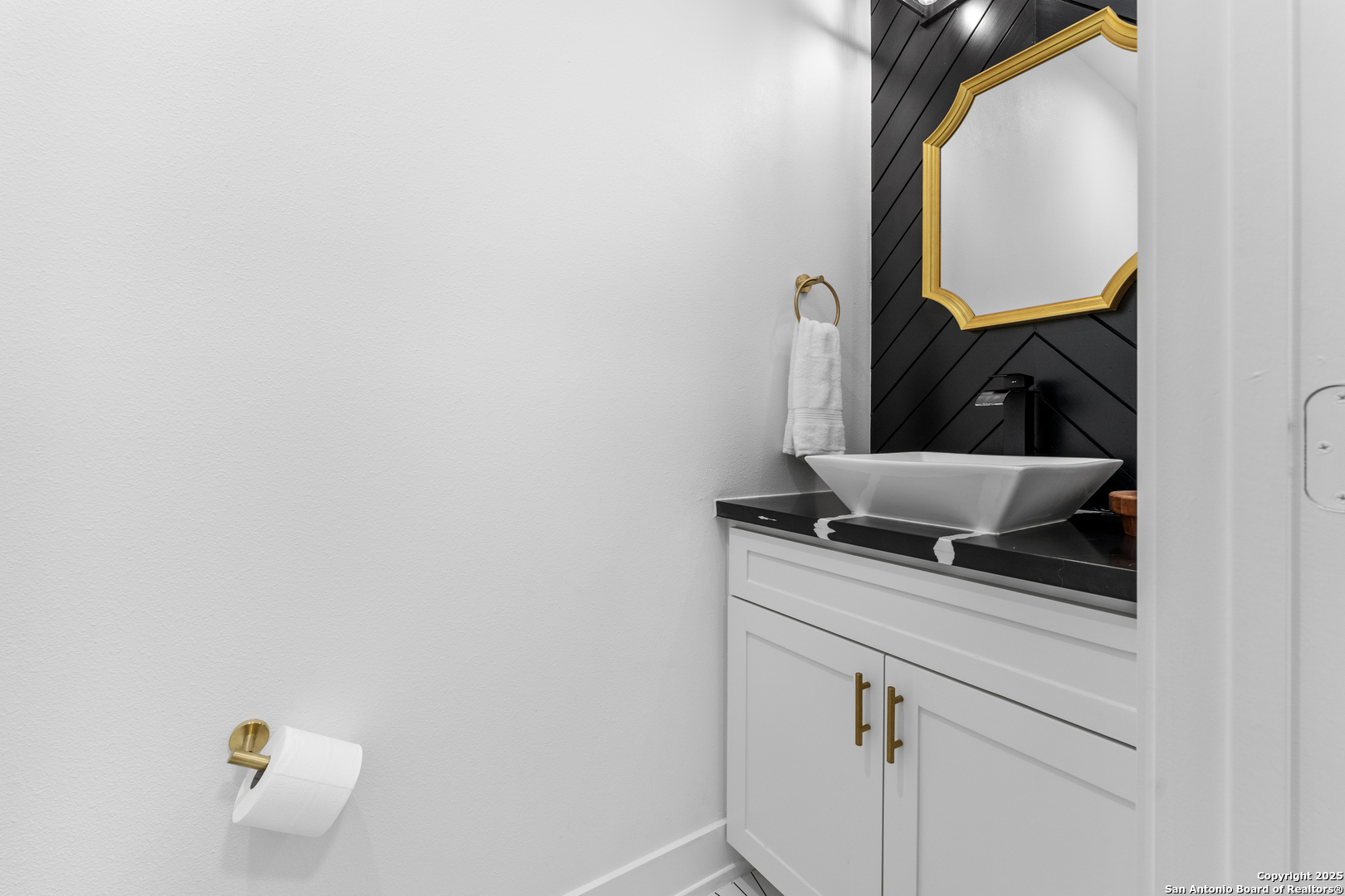 1101 Persimmon Pass Fischer, TX 78623 - Photo 18 of 43 a bathroom with a granite countertop sink and a mirror