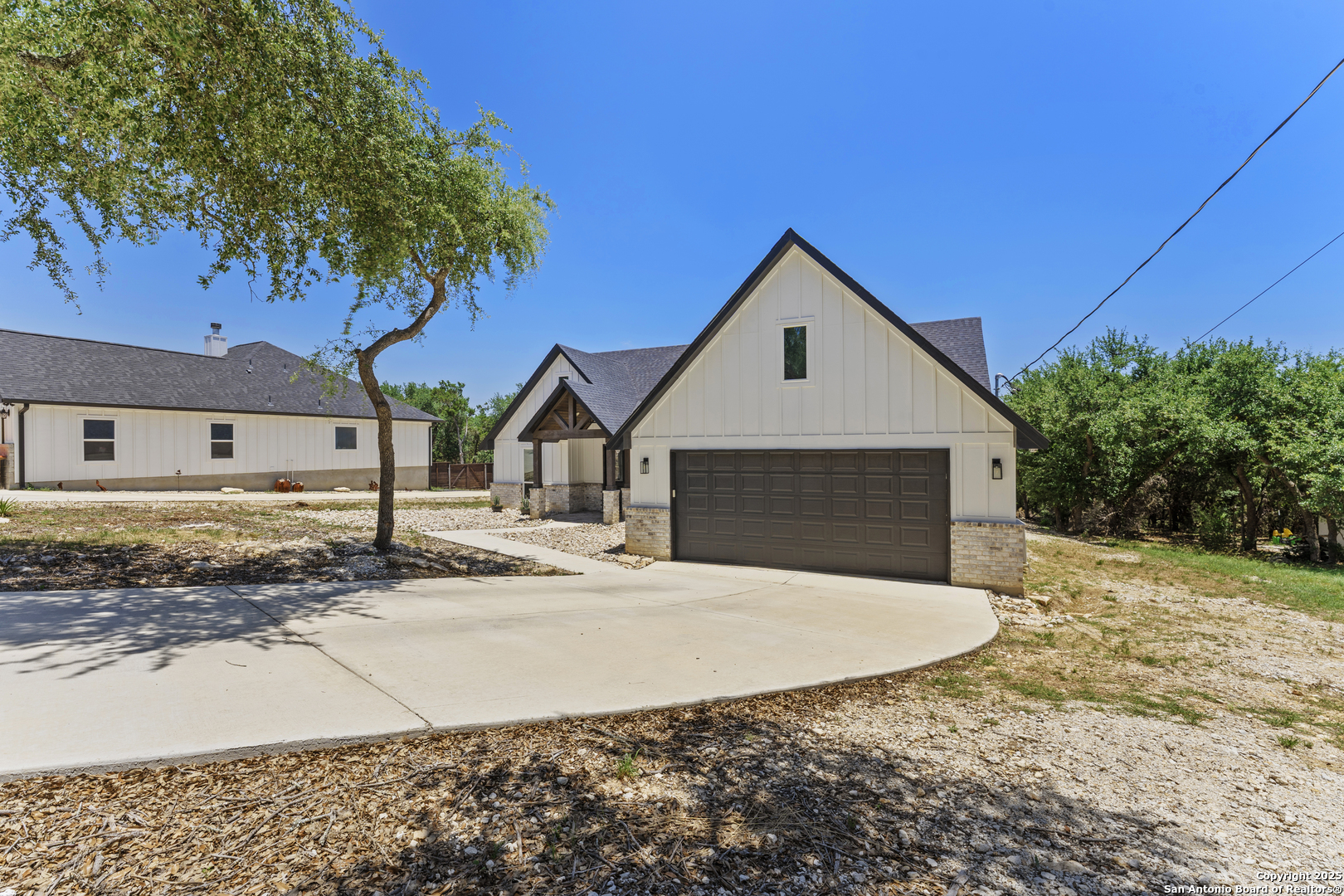 1101 Persimmon Pass Fischer, TX 78623 - Photo 2 of 43 a front view of a house with a yard