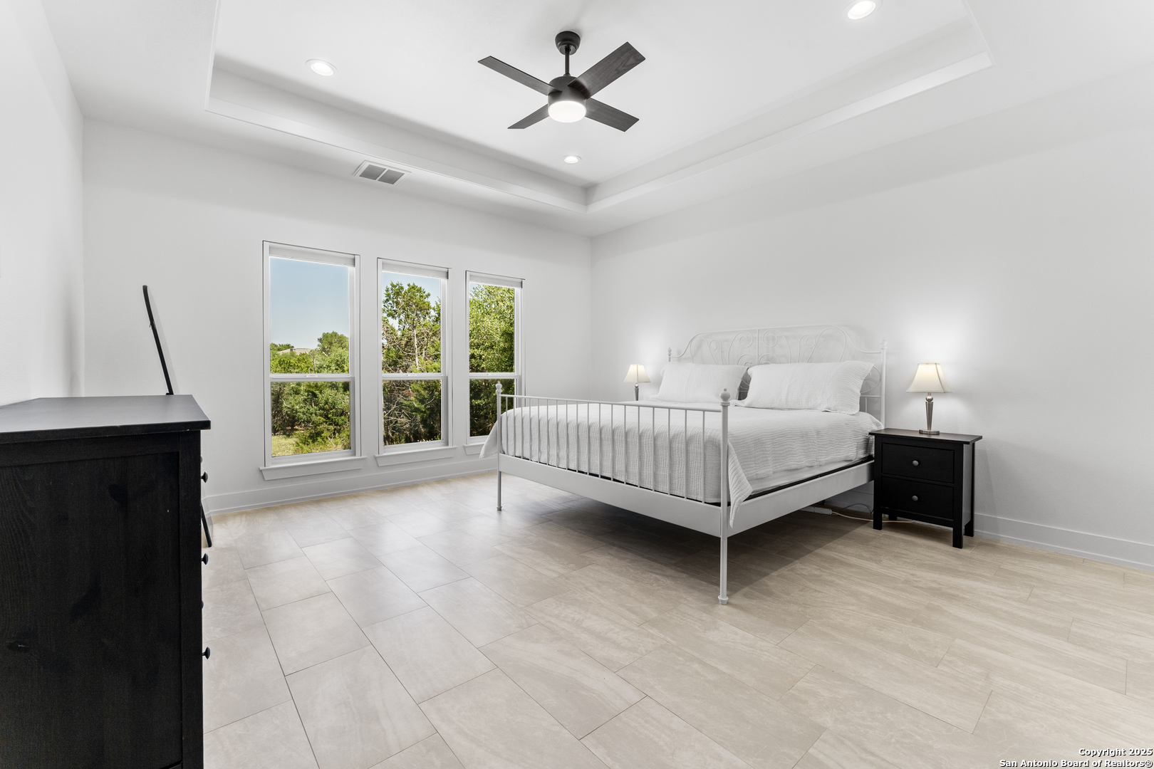 1101 Persimmon Pass Fischer, TX 78623 - Photo 22 of 43 a spacious bedroom with a bed and a window