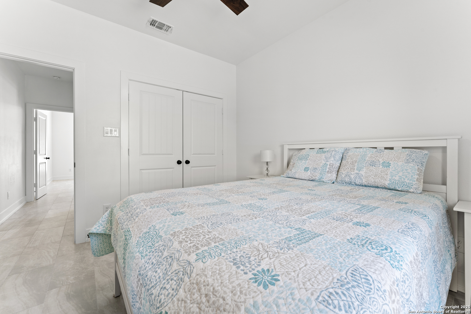 1101 Persimmon Pass Fischer, TX 78623 - Photo 32 of 43 a bedroom with a bed and cabinets