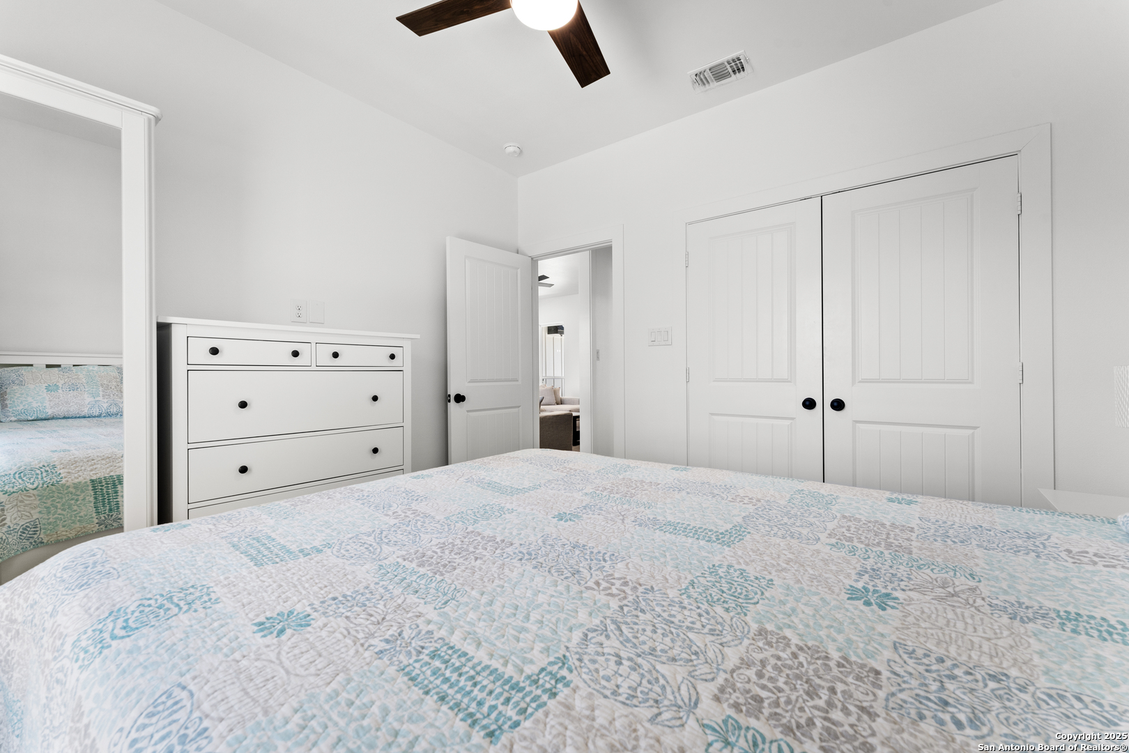 1101 Persimmon Pass Fischer, TX 78623 - Photo 33 of 43 a bed room with a bed and a ceiling fan