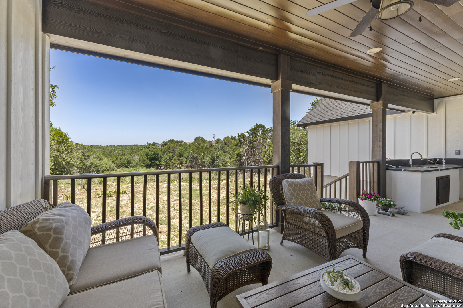 1101 Persimmon Pass Fischer, TX 78623 - Photo 39 of 43 a balcony with furniture and a potted plant