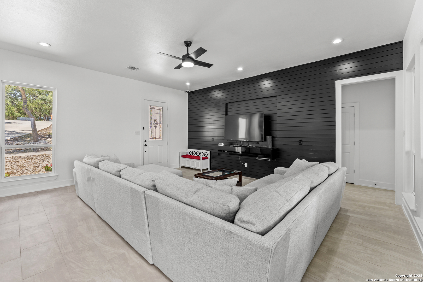 1101 Persimmon Pass Fischer, TX 78623 - Photo 6 of 43 a living room with furniture and a flat screen tv