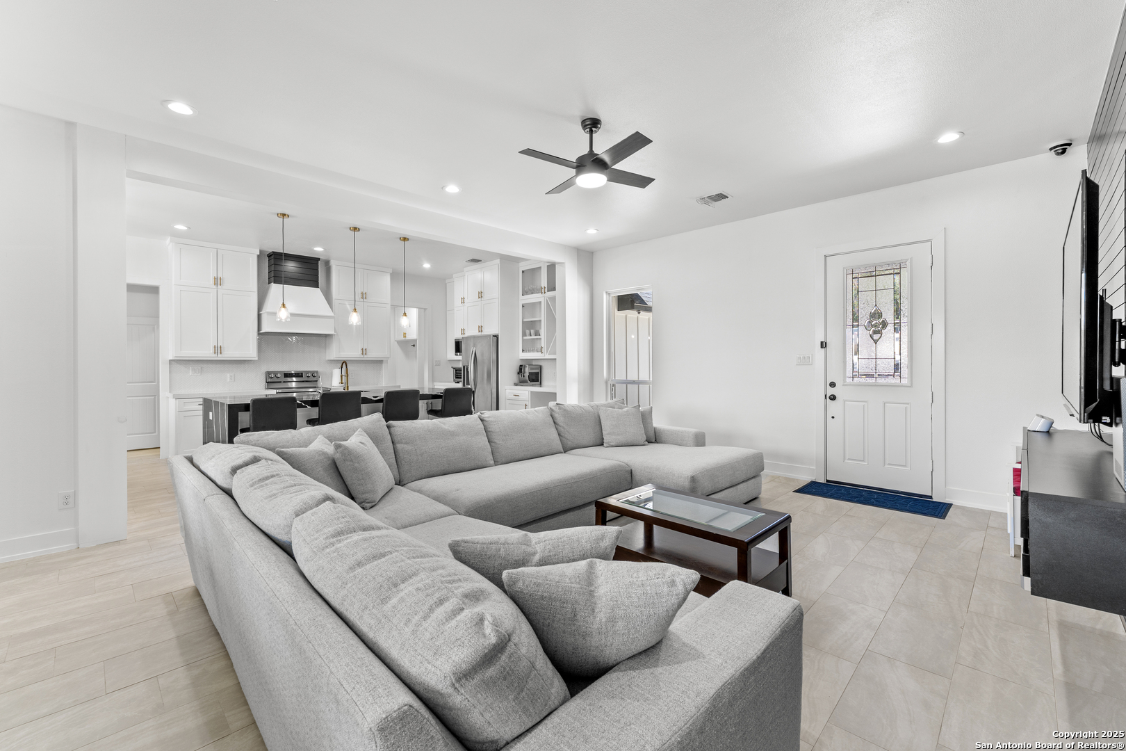 1101 Persimmon Pass Fischer, TX 78623 - Photo 7 of 43 a living room with furniture and kitchen view
