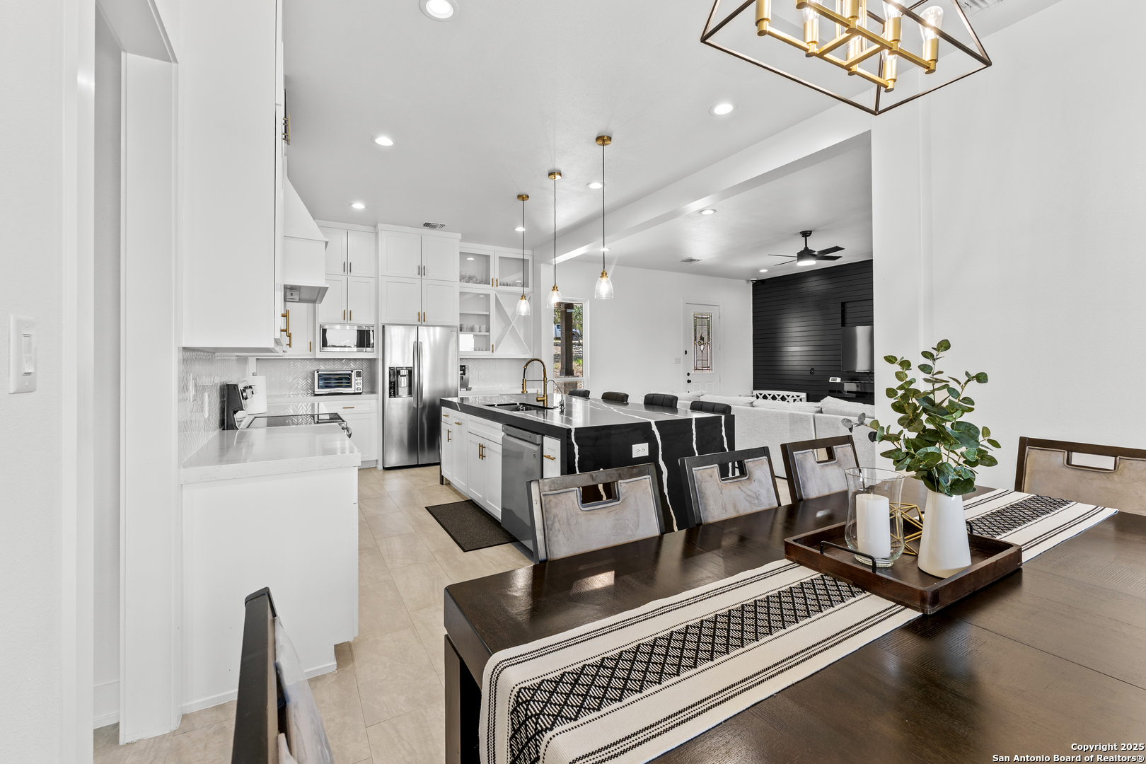 1101 Persimmon Pass Fischer, TX 78623 - Photo 9 of 43 a living room with furniture and a dining table with kitchen view