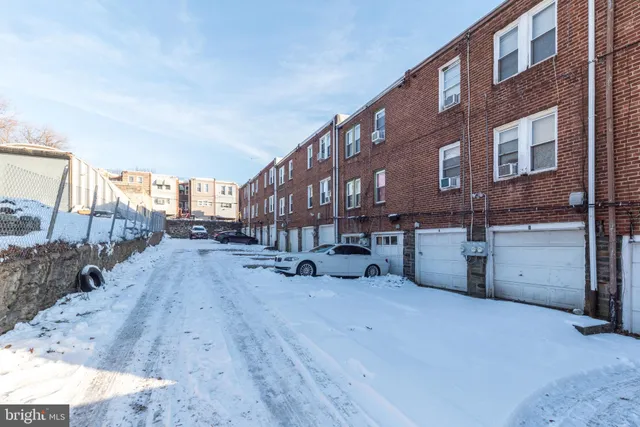 a view of a building with a yard