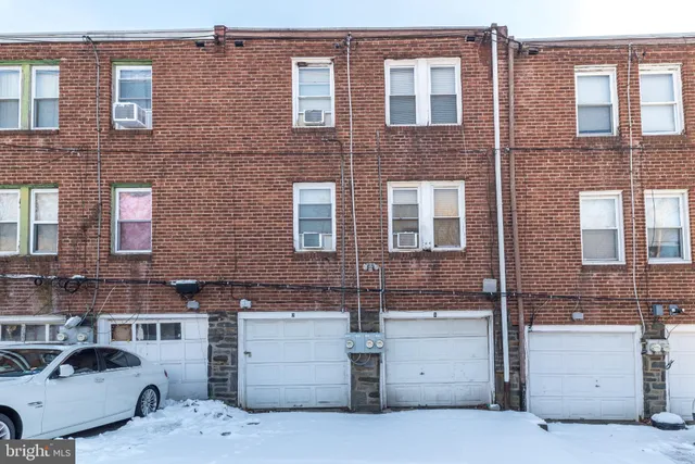 a view of a brick building with many windows