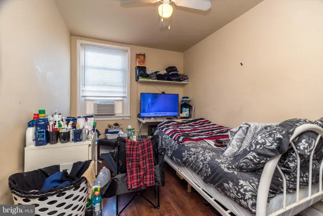 a bedroom with bed and a window