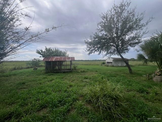 33632 Cobarrubias Road San Benito, TX 78586 - Photo 4 of 8 View of yard featuring an outdoor structure and a rural view