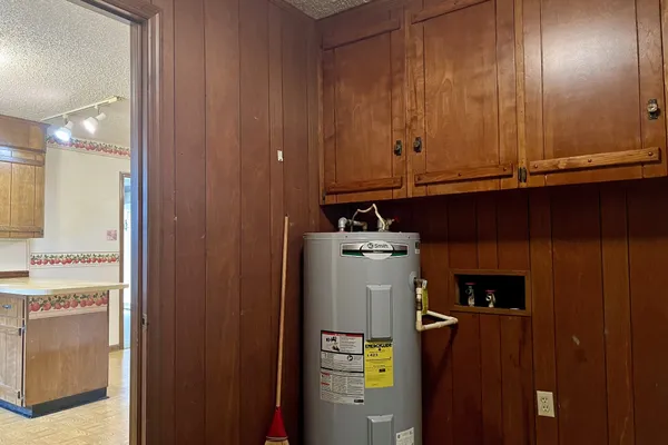 a view of a yard with a house and large trees