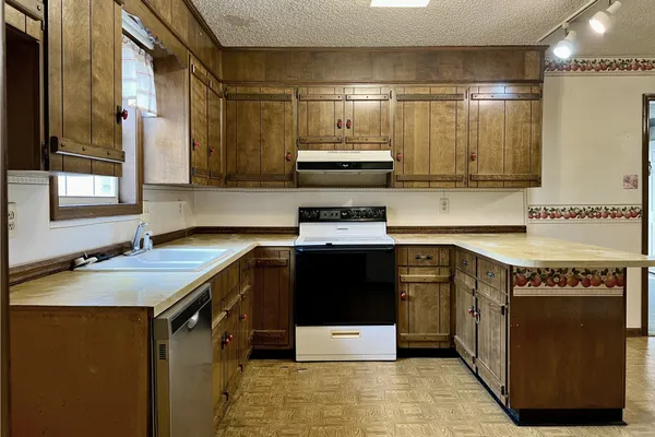 a kitchen with a stove and a sink