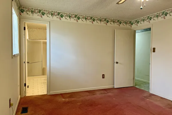 a view of a room with lots of racks on the wall