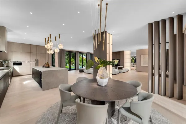 a dining room with furniture and window