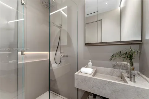 a front view of a house with plants