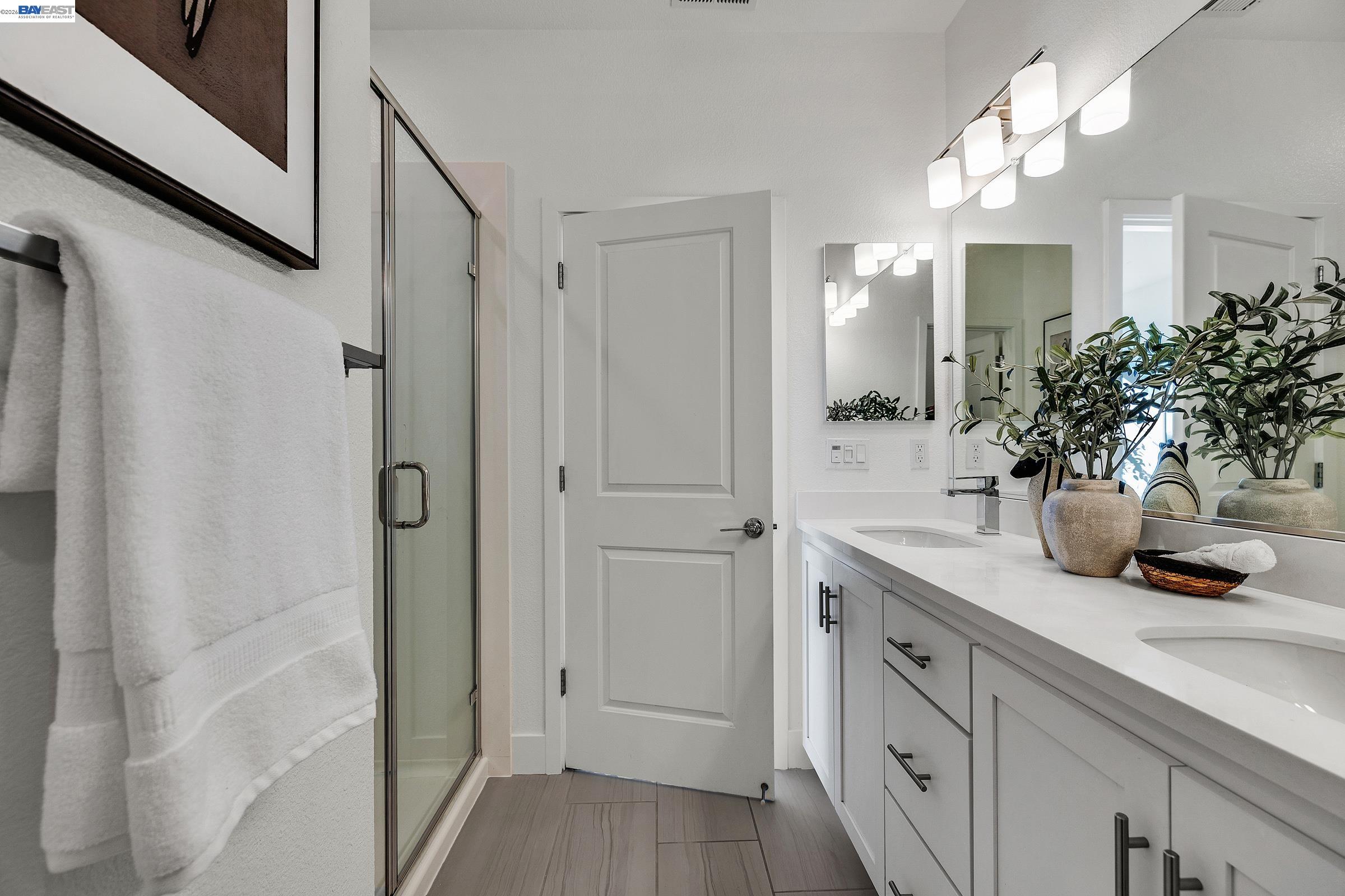 29259 Hub Court Hayward, CA 94544 - Photo 19 of 34 a bathroom with a sink a potted plant and a mirror