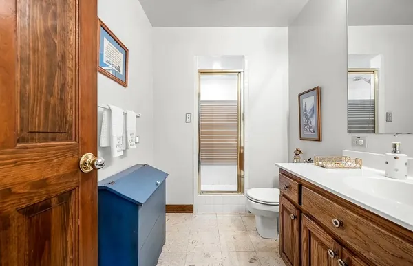 a room with stainless steel appliances kitchen island a table and chairs in it