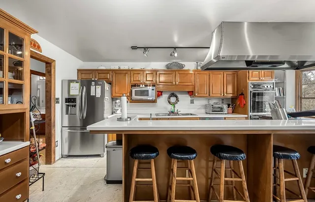 a bedroom with furniture and wooden floor