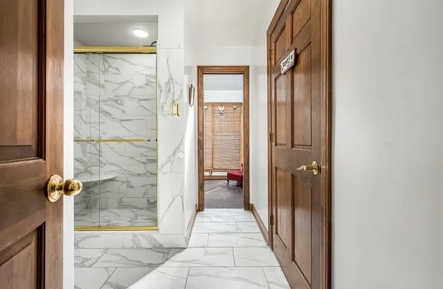 a bathroom with a bathtub sink and shower