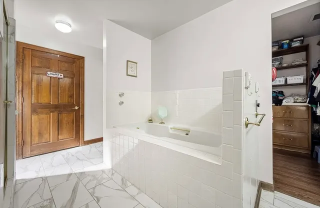 a kitchen with stainless steel appliances granite countertop a stove and a sink