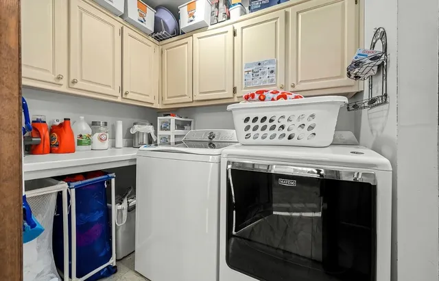 a view of a workspace with furniture and stairs