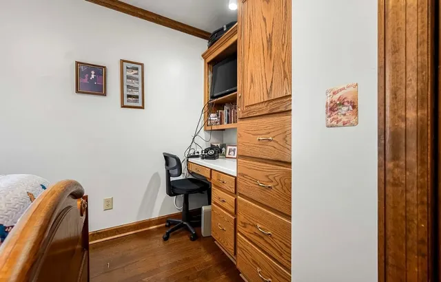 a view of a kitchen with stainless steel appliances kitchen island granite countertop a stove and a sink