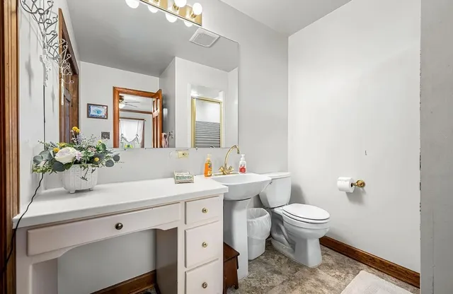 a bedroom with a bed and a flat tv screen on dresser