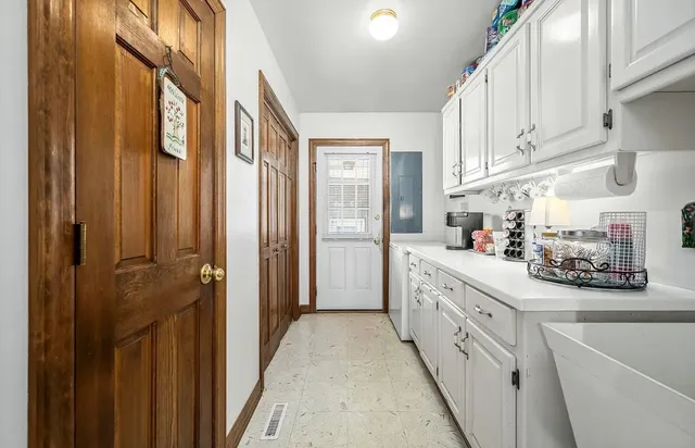 a kitchen with stainless steel appliances a sink stove and refrigerator