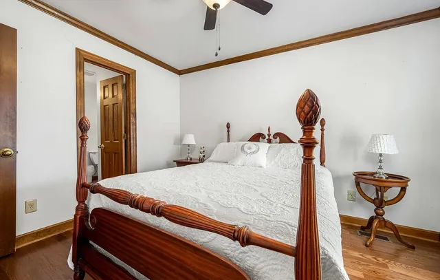 a kitchen with stainless steel appliances granite countertop a sink a stove and a wooden floors