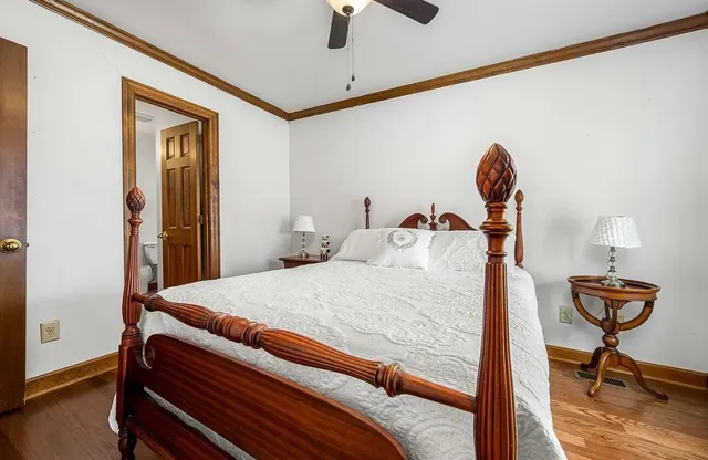 a bathroom with a shower and toilet