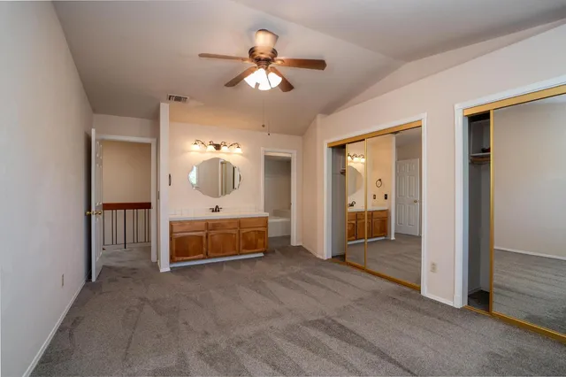 a bathroom with a sink a mirror and a shower