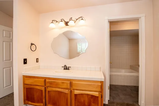a bathroom with a bathtub and a shower