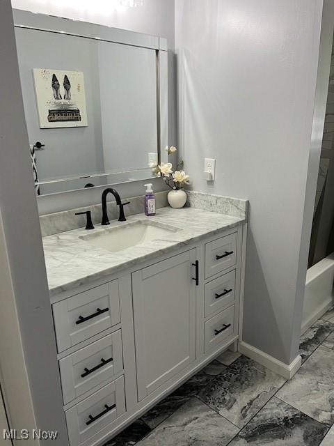 5795 Merwin Chase Road Brookfield, OH 44403 - Photo 25 of 39 Full bathroom featuring marble look tile flooring, vanity, and shower / bath combination