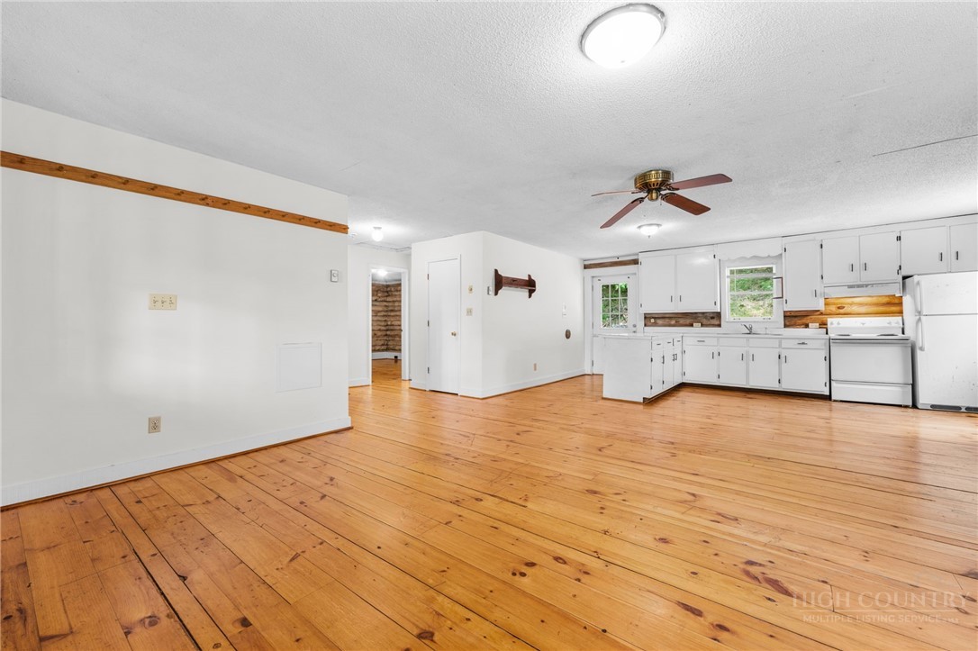 233 Alpine Acres Road Vilas, NC 28692 - Photo 10 of 32 a view of empty room with wooden floor