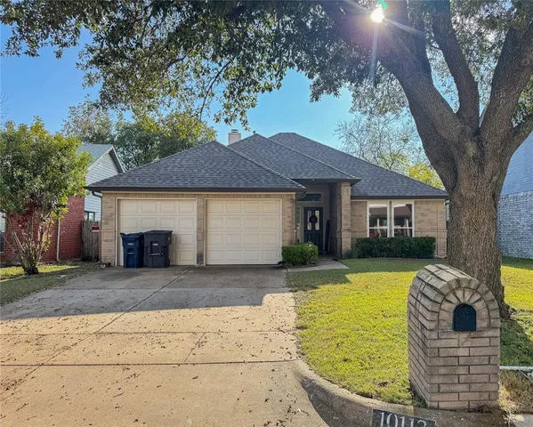 a view of house with outdoor space and swimming pool