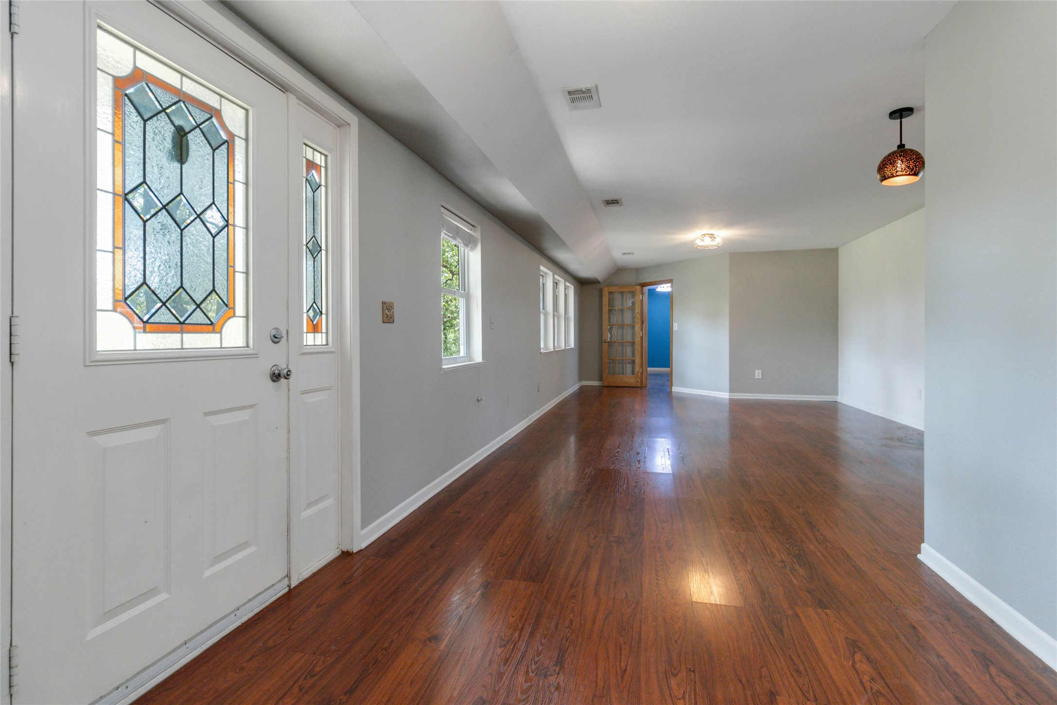 180 Ironstone Road Smithville, TX 78957 - Photo 6 of 37 a view of an empty room with wooden floor and a window