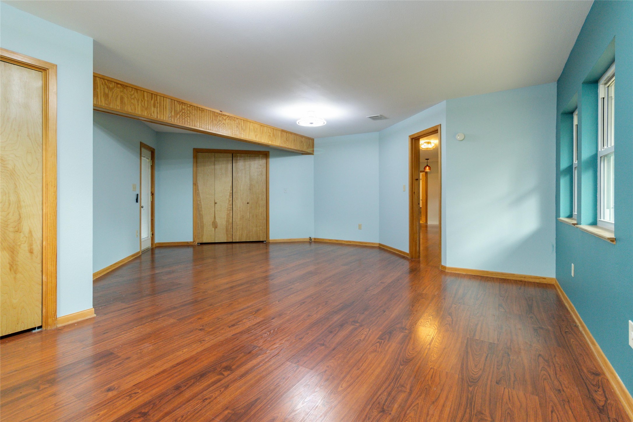 180 Ironstone Road Smithville, TX 78957 - Photo 9 of 37 a view of an empty room with wooden floor and a window