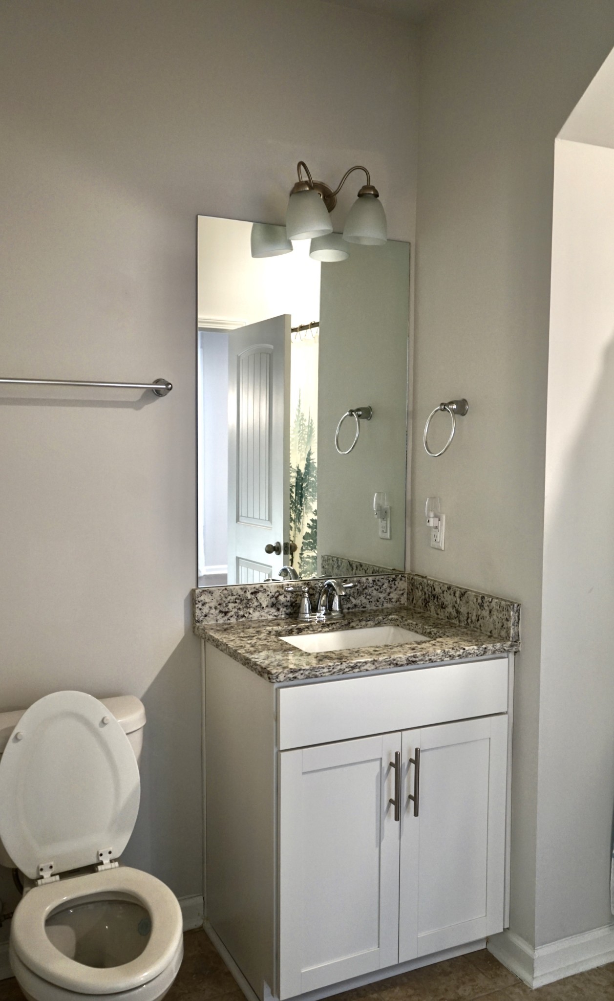 4221 Grapevine Loop Smyrna, TN 37167 - Photo 14 of 18 a bathroom with a granite countertop toilet sink and mirror