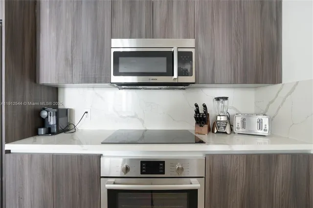 a kitchen with a stove and a microwave